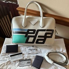 Prada Mirage Color: White Measurements: 12l X 4w X 7.5d Condition: Barely Used, Like New, Very Clean, Comes With Guarantee Card, Dust Bag Should Strap. Bags Prada, Prada Bags, Prada Bag, Prada, Dust Bag, Color White, Bag Lady, Like New, White