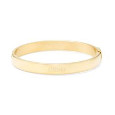 Add a touch of gold to your outfit with this gold plated oval bangle. The bangle is 7.5 inches long  and features a unique oval shape. The gold plated Stainless Steel bracelet can be engraved in two different places. Classic Gold-tone Bangle For Everyday, Classic Gold Plated Name Bracelet, Adjustable Oval Bangle With Polished Finish, Classic Gold Bracelet With Engraving Option, Classic Name Bracelet With Polished Bangle Finish, Classic Gold Name Bracelet With Engraving Option, Classic Name Bangle Bracelet With Polished Finish, Classic Gold-plated Name Bracelet, Classic Polished Name Bracelet Bangle