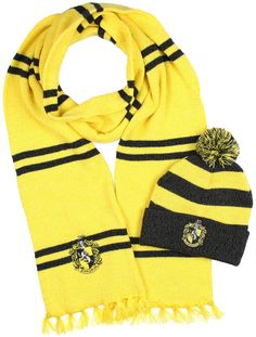 a scarf, hat and scarf on a white background with the image of a hogwarts symbol