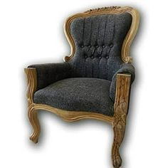 an old fashioned chair with wood trimming