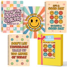 four notebooks with smiley faces on them and the words you're doing great