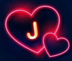 two neon hearts with the letter j on them