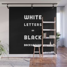 a black and white wall mural with the words white letters on black painted on it