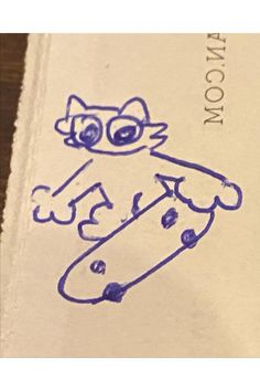 a drawing of a cat holding a tennis racquet on top of a book