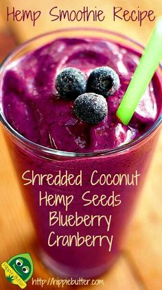 a smoothie in a glass with blueberries on top and the words, hemp smoothie recipe shredded coconut hemp seeds blueberry cranberry