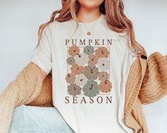 Are you looking for Mom Pumpkin Shirt? We got you! ✅ ABOUT OUR Gift for Mom Tee Comfort Color T-shirt  ▸ 100% ring-spun US cotton for long-lasting comfort.  ▸  The garment is sewn around the finished edges with double stitching, making it long-lasting ▸  The garment is dyed after it's been constructed, giving it a soft color and texture ▸ Printed and shipped from the USA ✅ HOW TO ORDER your Fall Season Shirt  1. Check our photos for sizing and color options. 📏 2. Choose your quantity. Feel free Fall T Shirts, Fall Graphic Tees, Boho Pumpkin, Fall Tee Shirts, Patch Shirt, Fall Graphic, Photo Care, Patches Shirt, Fall Tee