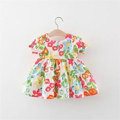 Brighten up your little girl's summer wardrobe with our Tropical Print Girls Dress and Woven Bag set, a perfect ensemble for the sunny season ahead. This two-piece set, featuring a vibrant tropical print dress and a complementary woven bag, is designed to add a splash of color and fun to your baby girl's daily wear. Ideal for beach outings, picnics, or any casual occasion, this set combines fashion with functionality in the most adorable way.The dress showcases a lively tropical print, full of vivid colors and exotic patterns that capture the essence of summer. The short sleeves and breathable fabric ensure your little one stays cool and comfortable, even on the hottest days.Accompanying the dress is a chic woven bag, perfect for carrying your little one's essentials or collecting treasure