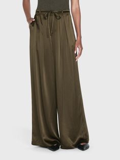 A 100% silk high rise, wide-leg trouser with front center pleats for a dramatic silhouette that drapes beautifully. Featuring a skinny waist tie for an adjustable fit and side and back pockets. High Rise FitDry Clean Only100% Silk13.25" Front Rise/32" Inseam/28.5" Leg Opening Dramatic Silhouette, Pleat Dress, Silk Trousers, Menswear Inspired, Guinea Bissau, Military Green, Brunei, Pleated Dress, Waist Tie