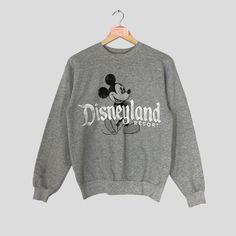 Vintage Rare DISNEYLAND Resort Crewneck Sweatshirt Big Logo DISNEYLAND Resort Jumper Pullover DISNEYLAND Resort Sweater Grey Colour Unisex CONDITION :- ✅GOODUSED CONDITION. ✅HAVE STAINS  ✅HAVE HOLE ITEM DESCRIPTION:- ✅SIZE: - ✅MATERIAL : COTTON ✅THIS USED & VINTAGE ITEMS, SO DON'T EXPECTED IT TO BE LIKE NEW CONDITION!! MEASUREMENT:- ✅ARMPIT TO ARMPIT : 20 INCH ✅LENGHT BACK COLOR/NECK TO HEM : 26 INCH ✅SHOUDLER : 20 INCH ✅SLEEVE LENGTH: 23.5 INCH PLEASE REFER PHOTO BEFORE ORDER ALL MEASUREMENTS ARE TAKEN WITH THE GARMENT FLAT ON THE GROUND THE PARCEL WILL BE ARRIVE WITHIN 10-14 DAYS WORKING DAYS OR MORE DUE TO THE LOCATION & CUSTOMS CLEARINGS. BUYER DON'T HESITATE TO ASK ME IF ANY INQUIRY ABOUT ITEM BEFORE PURCHASING. PLEASE BEWARE THESE ARE VINTAGE ITEM. PLEASE CAREFULLY CHECK THE ITEM MEA Retro Gray Long Sleeve Tops, Retro Gray Crew Neck Top, Gray Retro Crew Neck Top, Disneyland Parks, Sweater Grey, Grey Colour, Disneyland Resort, Grey Sweater, Disneyland