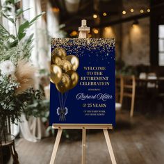 a blue and gold celebration sign with balloons