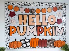 a bulletin board with pumpkins and leaves on it that says hello pumpkin written in large letters