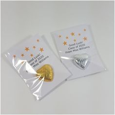 two gold and silver heart shaped candy bags