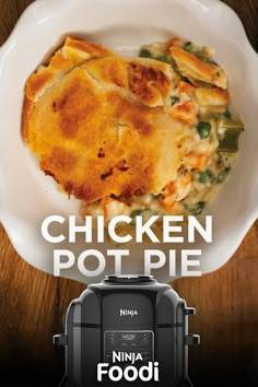 a chicken pot pie sitting on top of a white plate