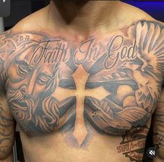 a man with tattoos on his chest and cross