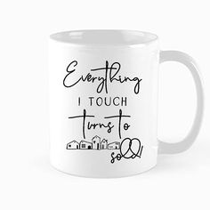 a white coffee mug with the words everything i touch turns to love