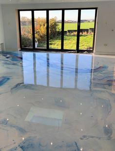 blue, red, purple blend pigments swirled on white base-coat of epoxy Blue Marble Bathroom, Concrete Floors In House, Ranch House Remodel, Epoxy Floors, Epoxy Wood Table, House Dressing