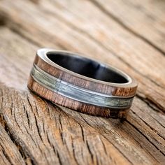 a wedding band with wood and silver inlays