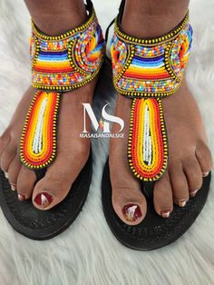 100% handmade using leather and fine beads. Masai beaded sandals are made using the pure original leather and quality African beads.They are inspired by the Masai community They are perfect for any occasion. True to size. We ship worldwide. Feel free to send me a convo for any clarifications Beaded Bohemian Toe Ring Sandals, Traditional Beaded Flip Flops For Festivals, Traditional Beaded Barefoot Sandals With Single Toe Strap, Traditional Beaded Toe Post Flip Flops, Bohemian Beaded Leather Toe Ring Sandals, Traditional Handmade Adjustable Sandals, Traditional Handmade T-strap Sandals For Festival, Traditional Multicolor Beaded Flip Flops, Traditional Beaded Toe Post Sandals