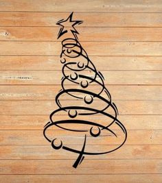 a drawing of a christmas tree on wood