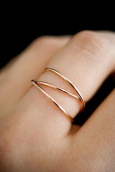 This item is made to order and will ship after 7-10 business days. That time does not include holidays, weekends or shipping time!This is a gorgeous ring made of 14K Rose Gold-fill metal. We wrap a length of 14K Rose Gold-fill around three times and securely solder it around back. Then the ring is either hammered for a reflective shine or left with the original smooth, rounded finish.The beauty of this ring lies in its organic shape. We can never create the same wrapped effect twice, which means Rose Gold Statement Ring, Rose Gold Rings Simple Unique, Gold Wrap Ring, Jewelry Hacks, Fav Products, Criss Cross Ring, Woven Ring, Products Photography, Zierlicher Ring