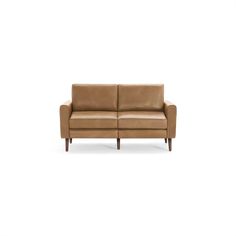 a brown leather couch sitting on top of a white floor next to a wooden frame