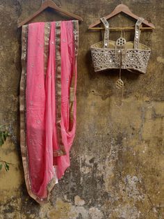 This beautiful blush pink pure chiffon saree with art mirror and pearl hand work highlights has a mirror work border with copper accent.  It is paired with a mirror and pearl work bustier blouse.
*Ready to ship in sizes XS, S, M, L Pink Pre-draped Saree With Mirror Work, Pink Chinon Pre-draped Saree For Navratri, Pink Pre-draped Chinon Saree For Navratri, Pink Pre-draped Saree With Unstitched Blouse In Chinon, Designer Pink Pre-draped Chinon Saree, Designer Wear Pink Chinon Pre-draped Saree, Pink Pre-draped Chinon Saree With Unstitched Blouse, Pink Chinon Pre-draped Saree For Designer Wear, Festive Pink Pre-draped Saree With Mirror Work