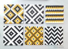 four squares made out of legos with yellow and black designs on them, all in the same pattern