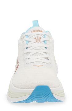 a white and blue shoe on a white background