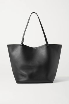 The Row's medium 'Park 3' tote is a timeless, versatile accessory that's great for the office, weekends and travel alike. Sized to hold all your essentials, plus a tablet or notebook, it's been made in Italy from supple leather and has slim, elegant handles.Wear it with: [The Row Pants id1123577], [The Row Sweater id1265672], [The Row Shirt id1276177], [The Row Ballet flats id1281730]. The Row Bag, Buy Leggings, Bag Trends, Gold Accessories, Black Tote, Black Bag, Black Tote Bag, J Brand, Mr Porter