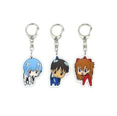 three keychais with anime characters on them, one is blue and the other is red