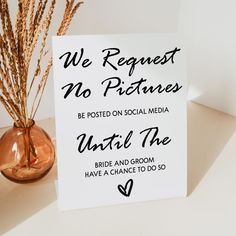 a sign that says we request no pictures to be posted on social media until the bride and groom have chance to do so