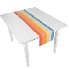 a white table with multicolored stripes on it