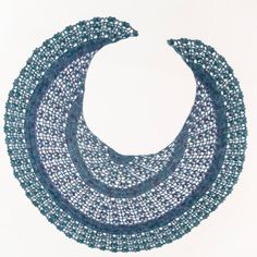 a blue and white necklace with beads on it's end, in the shape of a circle