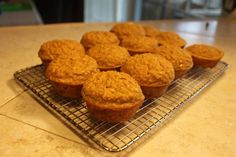 several muffins cooling on a wire rack