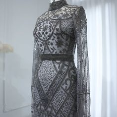 Experience elegance and sophistication with the Dreamy Vow Luxury Beaded Gray Muslim Evening Dress. Featuring intricate beading and a flattering flare silhouette, this dress is perfect for any formal occasion. The long sleeves add a touch of modesty, making it suitable for Muslim women. Elevate your style and make a statement at any wedding or party with this stunning gown. Wedding Dress Overskirt, Arabic Women, Custom Flower Girl Dress, Yellow Evening Dresses, Silver Evening Dress, Grey Evening Dresses, Champagne Evening Dress, Purple Evening Dress, Muslim Evening Dresses