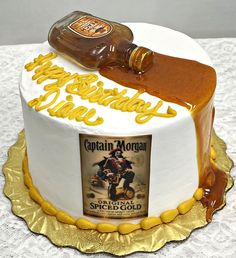 a birthday cake with a bottle of captain morgan on top