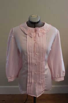 ladies vintage 1970's pink button down blouse  cute neckline  3/4 sleeve  armpit to armpit: 23 shoulder to shoulder: 21 shoulder to bottom of sleeve: 22 armpit to bottom of shirt: 17 MOD NOS no tags Ladies Blouse, Womens Blouses, Vintage Blouse, 70s Vintage, Cosplay Ideas, Button Down Blouse, Historical Clothing, Vintage Pins, Pink Shirt