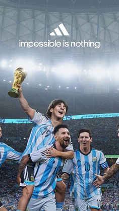 two soccer players are holding the trophy in front of their heads and celebrating with each other