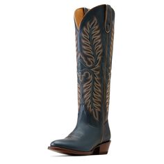 Take your style game to new heights with this tall, timeless beauty. Classic Western stitching nods to tradition, while the 18-inch shaft elevates any look. Bonus: StretchFit makes it easier to pull on and expands to fit a wide range of calves. Belle Stretchfit Western Boot | Product Features : 0 : ATS® technology provides ergonomic support on uneven terrain, 1 : StretchFit panels under the pull tabs give an additional inch to fit a wide range of calves, 2 : Vegetable-tanned leather sole, 3 : Resoleable Goodyear leather welt construction, 4 : Five-row stitch pattern, 5 : Ariat is including you in its dedication to environmental stewardship. By purchasing this product, you are supporting the responsible production of leather at Leather Working Group-certified tanneries. | Women's Belle Stre Navy Cowboy Boots, Environmental Stewardship, Western Boot, Penn State, Dress And Heels, Cowgirl Boots, Vegetable Tanned Leather, Western Boots, Leather Working