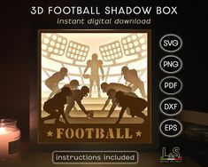 the 3d football shadow box is next to a lit candle