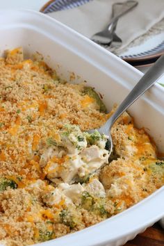 a casserole dish with broccoli and cheese in it, ready to be eaten