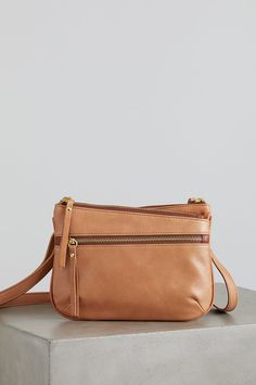 From day to day, the Florence crossbody bag is your elegant carryall. Crafted from Argentine cowhide leather with a gently pebbled texture, this multi-zip crossbody features durable nylon lining and can be worn over the shoulder or across your chest, thanks to its removable, adjustable strap. 3 zip compartments and an open center space with magnetic closure offer plenty of room for your personal, work, and travel belongings. Fall Crossbody Bags With Zipper Pocket, Everyday Crossbody Shoulder Bag With Zipper Closure, Everyday Crossbody Shoulder Bag With Zipper, Leather Bags With Zipper Pocket For Fall, Fall Leather Bags With Zipper Pocket, Brown Crossbody Satchel With Zipper Closure, Versatile Crossbody Satchel With Zipper Pocket, Versatile Leather Satchel With Zipper Closure, Versatile Crossbody Satchel With Zipper Closure