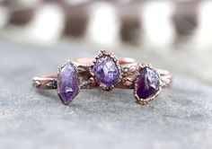 This listing is for one made-to-order raw amethyst crystal ring that is outrageously gorgeous, organic, and rustic. The deeply purple stones are set on an elegant floral copper band.  I created the ring with a technique called electroforming. Copper is deposited over the stone over 12-24 hours using electrical currents. It creates a gorgeously organic and hefty piece with a setting that looks like animal skin or something pried right out of the earth. The copper has been given a darkened patina Nature-inspired Amethyst Gemstone Jewelry, Rustic Hand Forged Ring Jewelry, Bohemian Amethyst Ring With Natural Stones, Electroformed Wedding Ring Jewelry, Purple Natural Stones Jewelry, Nature-inspired, Rustic Gemstone Jewelry For Gifts, Nature-inspired Amethyst Healing Jewelry, Nature-inspired Purple Jewelry With Natural Stones, Purple Nature-inspired Jewelry With Natural Stones