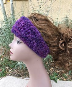 a mannequin head wearing a purple knitted headband