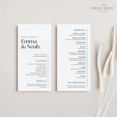 two white wedding programs on top of each other next to some flowers and cotton stems