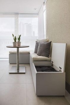 a living room filled with furniture next to a window