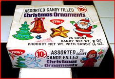 an assortment of candy filled christmas ornaments in a box on the counter top