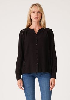 [Color: Black] A front facing image of a blonde model wearing a black linen blend bohemian blouse. With voluminous long sleeves Fall Button-up Tops With Lace Trim, Fall Lace Trim Button-up Tops, Fall Blouse With Button Closure For Layering, Bohemian Tops With Button Cuffs And Long Sleeves, Long Sleeve Tops With Crochet Trim For Daywear, Long Sleeve Cotton Blouse With Crochet Trim, Elegant Long Sleeve Blouse With Crochet Trim, Cotton Long Sleeve Blouse With Crochet Trim, Cotton Blouse With Crochet Trim Long Sleeve