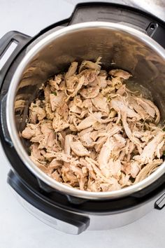 shredded meat in an instant pot on the stove