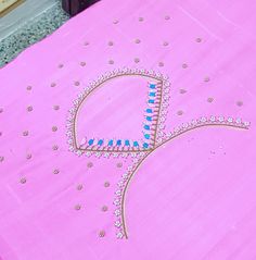 a pink cloth with blue and white designs on it